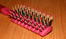 Hairbrush with ball-dipping